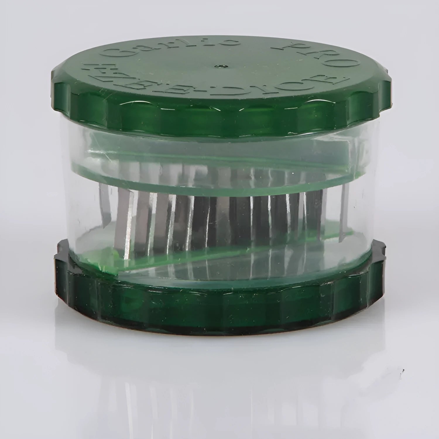Green transparent PP plastic garlic peeler kitchen gadget with dimensions 8.5x8.5x6cm
