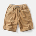 Men's khaki retro cargo shorts with multiple pockets in straight-leg streetwear style
