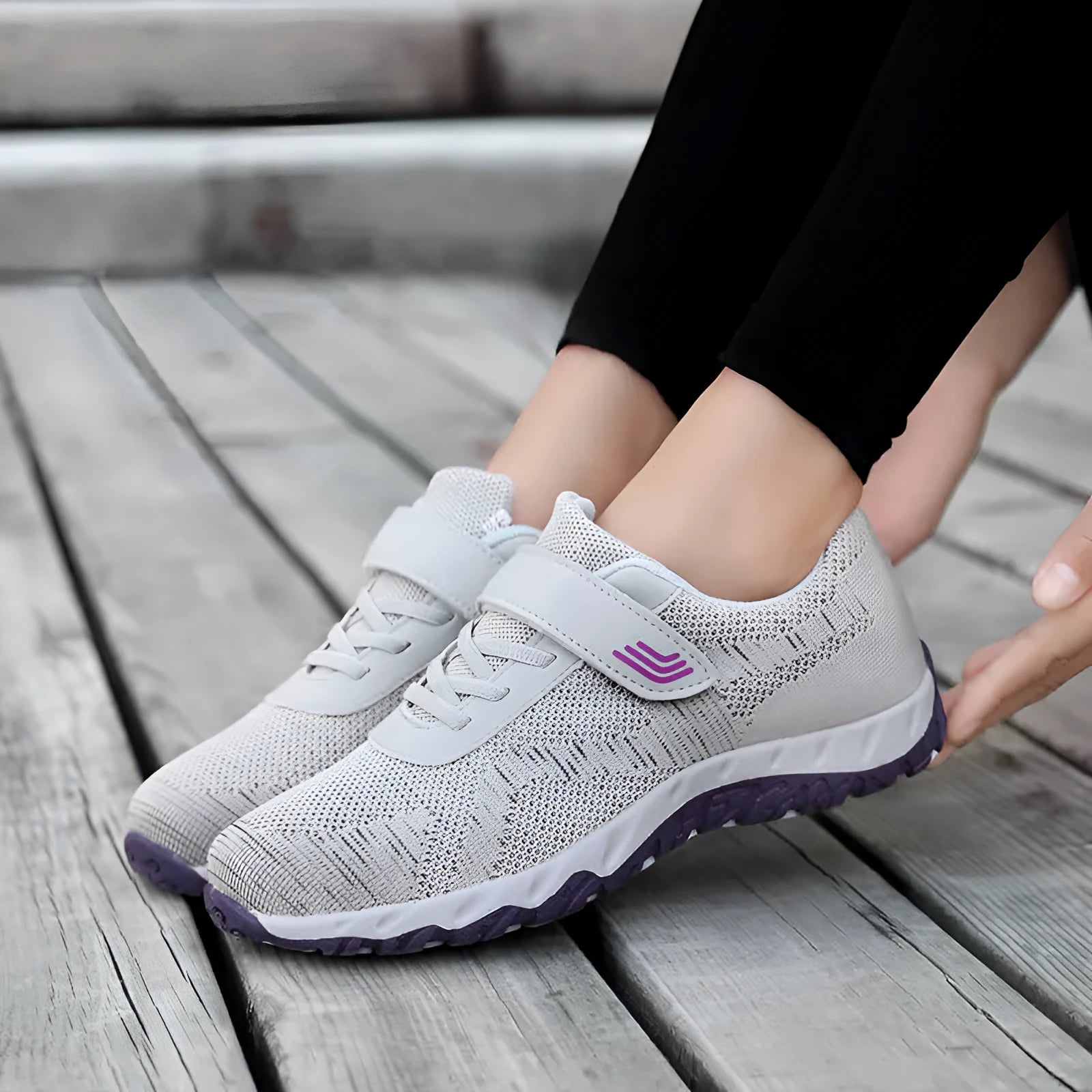 Women's low-top casual sneaker with mesh upper, wedge heel, and Velcro strap fastening.