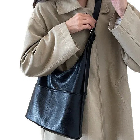 Women's large-capacity PU crossbody bag in coffee or black, 25cm high, 30cm wide, 12cm thick, with small bag.