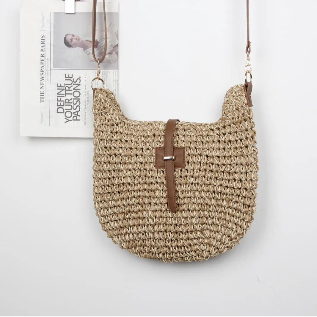Beige handmade woven crossbody bag with a sandwich pocket and adjustable shoulder strap.
