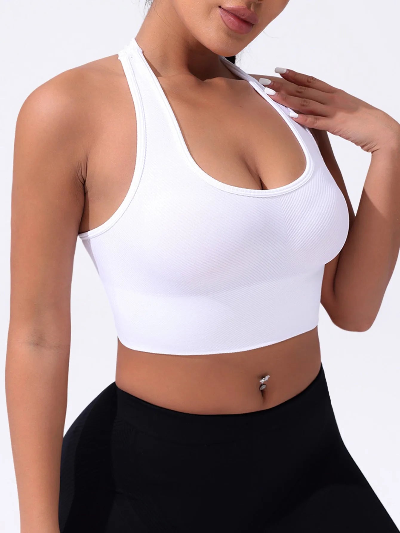 Black women's sports bra with cross-back design and moulded cups for running and yoga