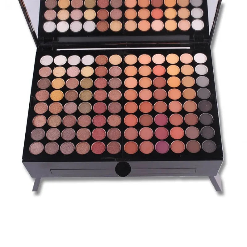 Piano-shaped makeup palette box containing 180 eyeshadow colours with powder, blush and contour cosmetics