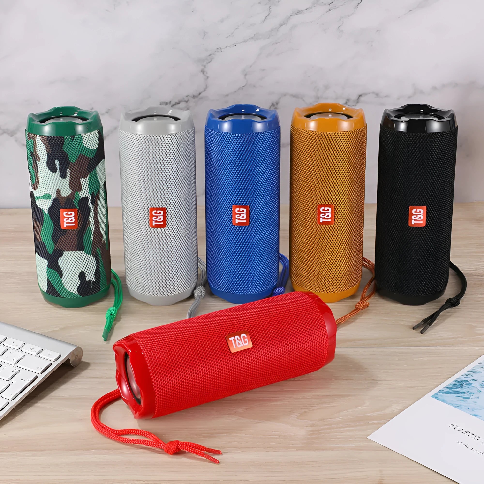 Fabric-covered portable Bluetooth speaker with a visible card holder slot in a choice of colours.