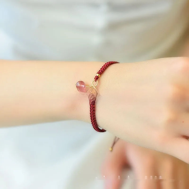 Natural Strawberry Quartz cherry-shaped bracelet for women on a white background.
