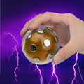 Gold electric shocking ball toy with red and blue LED light, plastic and electronic construction, 2 AAA batteries