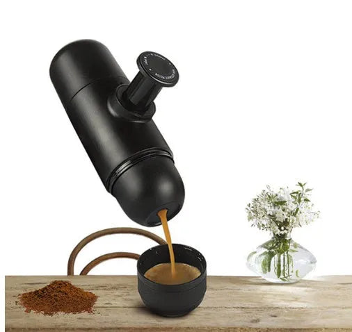 Black portable manual coffee machine showing compact 6x17.5cm design with stainless steel components