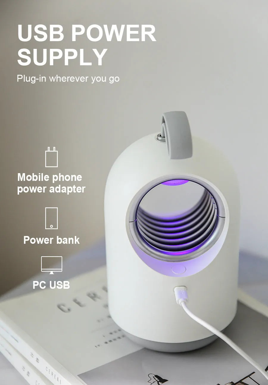 White or blue indoor mosquito killer lamp with UV light, fan, and silicone carry handle.
