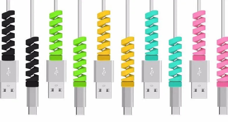 Plastic spiral charging cable protector in various colours next to a USB cable.