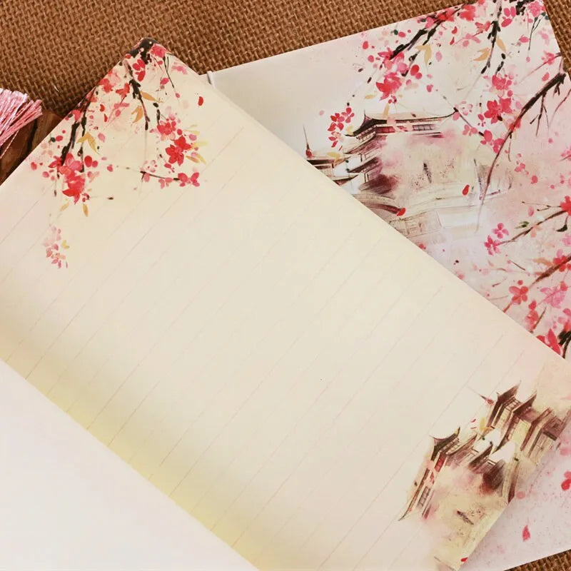 Chinese watercolour style thread-bound notebook in Azalea colour showing traditional binding and open pages