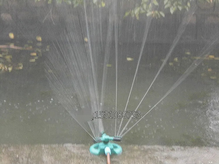 360 Rotating Sprinkler with Big 3 fork design on garden lawn, 210mm x 190mm x 95mm
