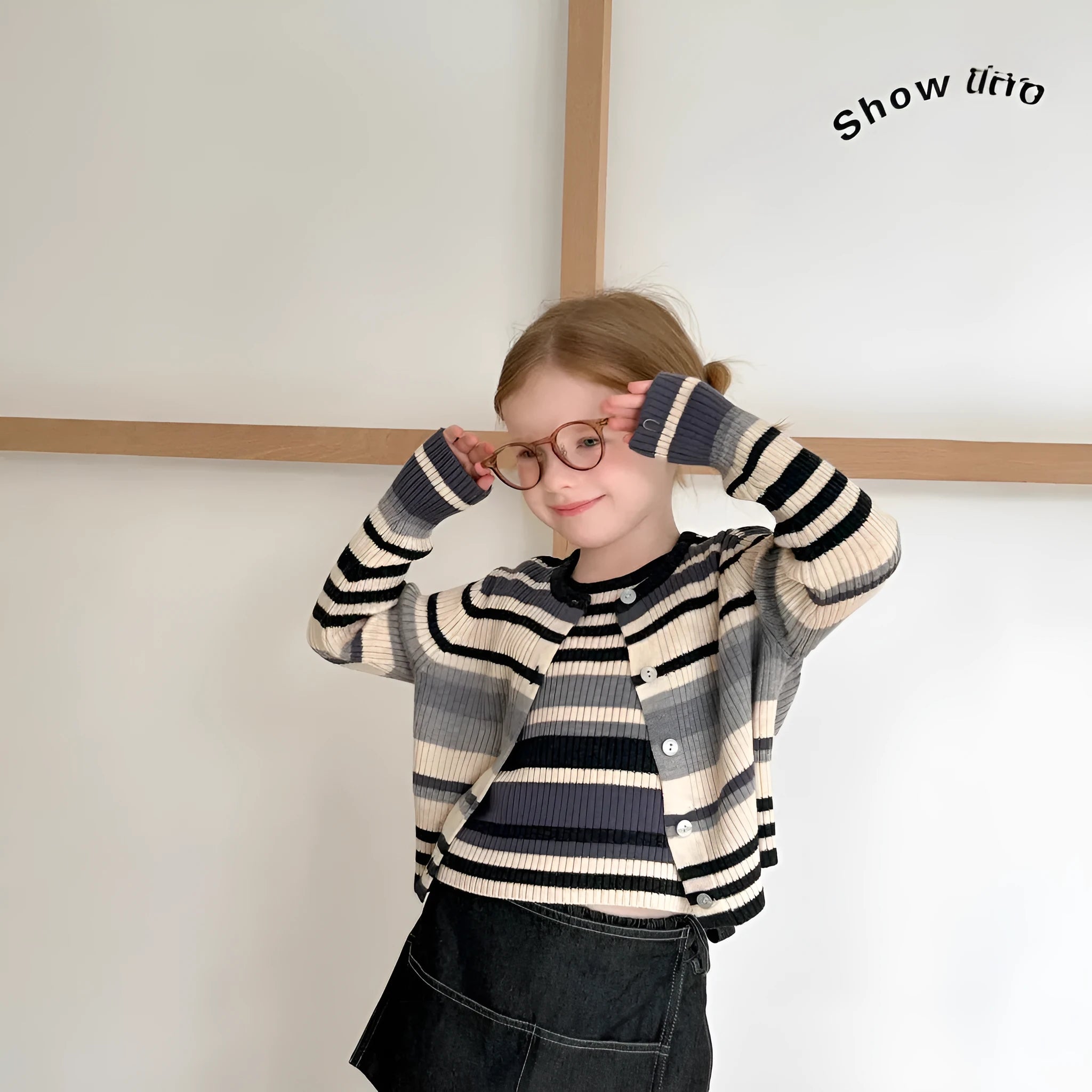 Girls gray striped knitted vest and cardigan two-piece set on white background, acrylic fine yarn