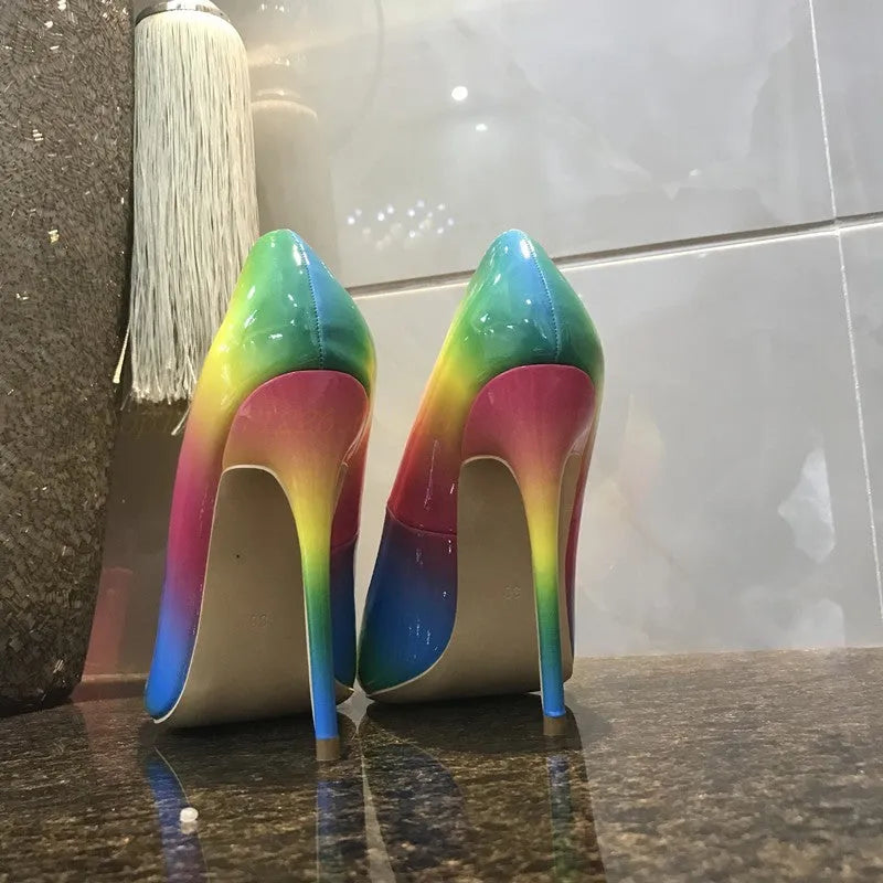 Women's rainbow patent leather high heel court shoes with pointed toe and thin ultra-high heel.