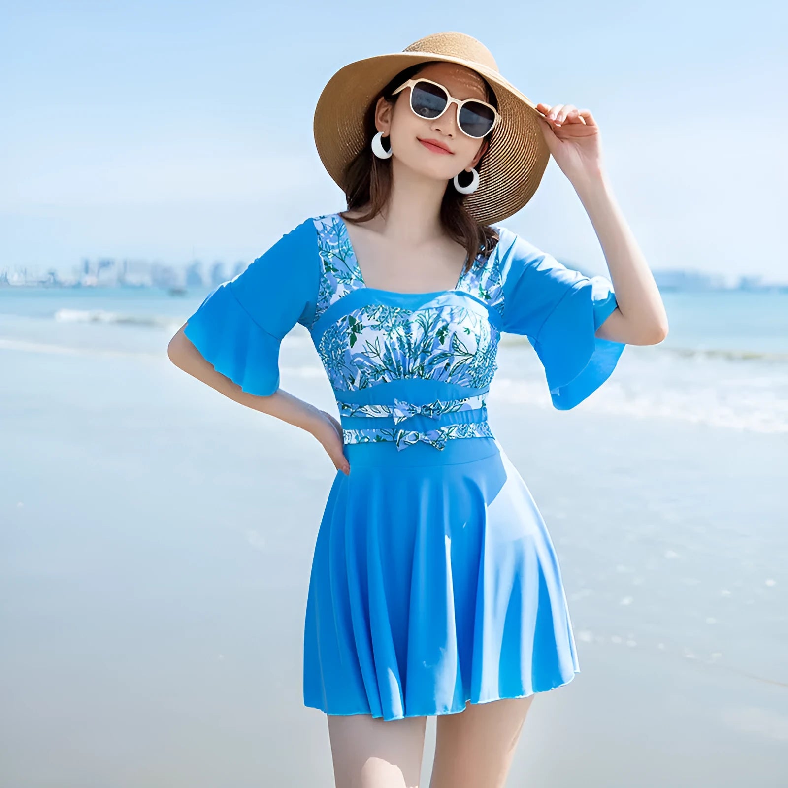 Women's blue and green printed one-piece swimsuit with seaside pattern
