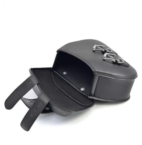 Black PU leather motorcycle saddlebags for left and right side storage, 28x18x12cm on a cruiser bike