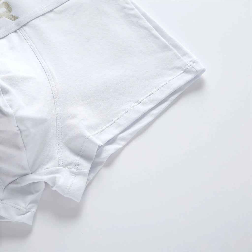 Men's purified cotton low waist boxer shorts in solid white, black, or grey, sizes M to XXL