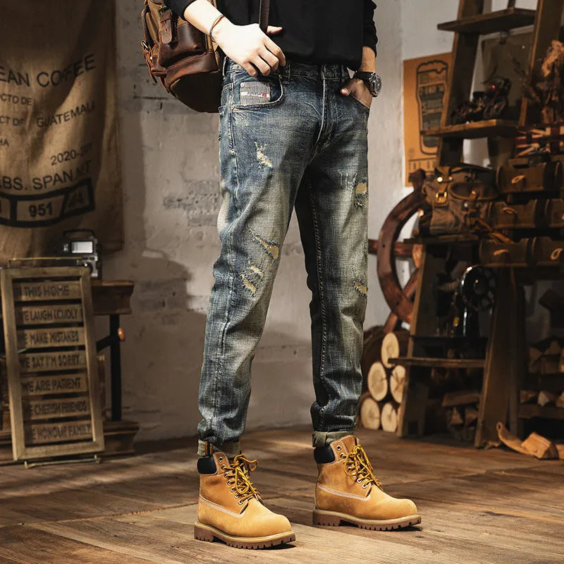 Man wearing vintage blue loose straight-leg jeans with a fleece lining and drawstring waist.