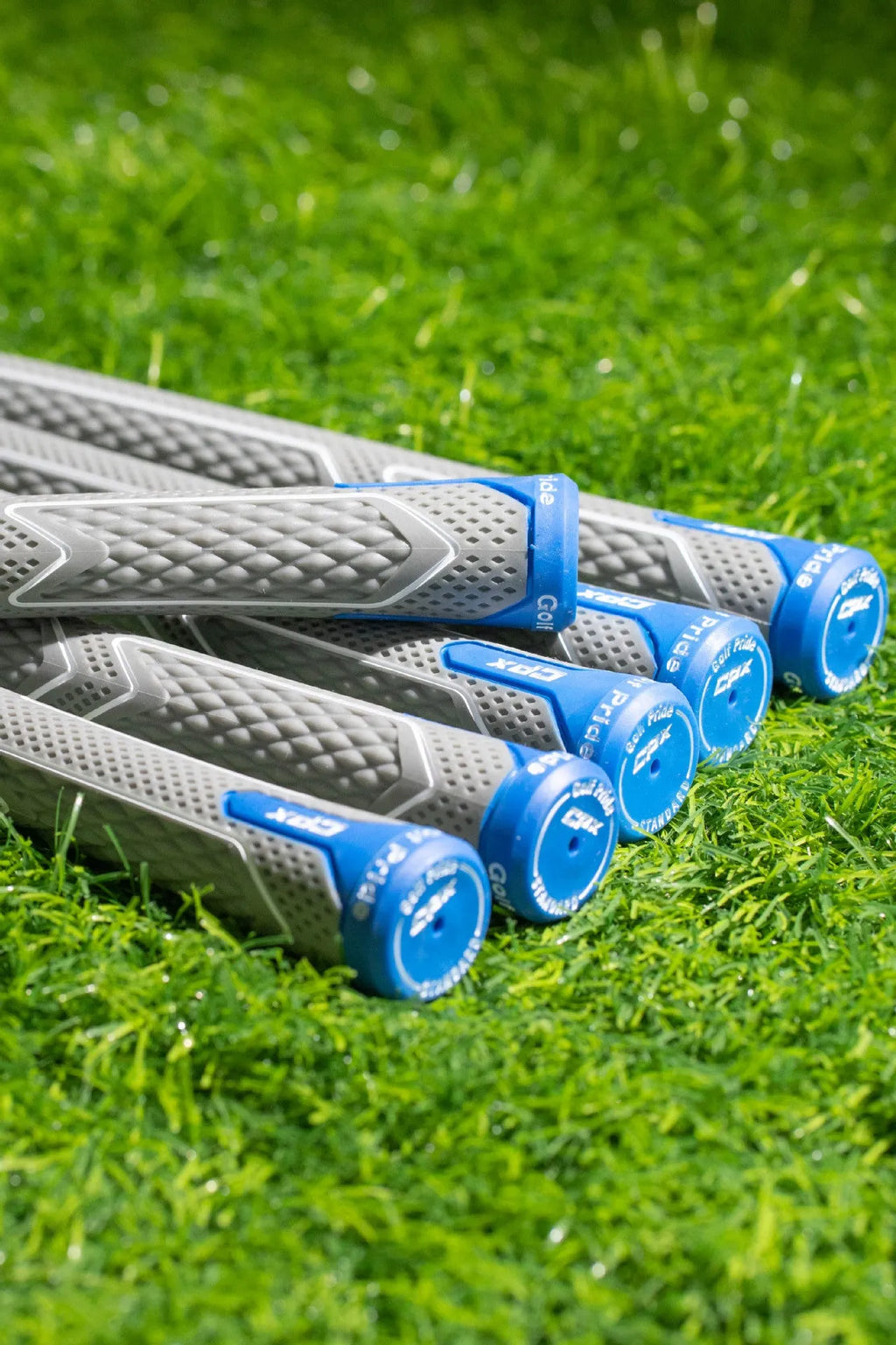 Natural rubber and cotton yarn golf club grip in female, standard, medium and large sizes