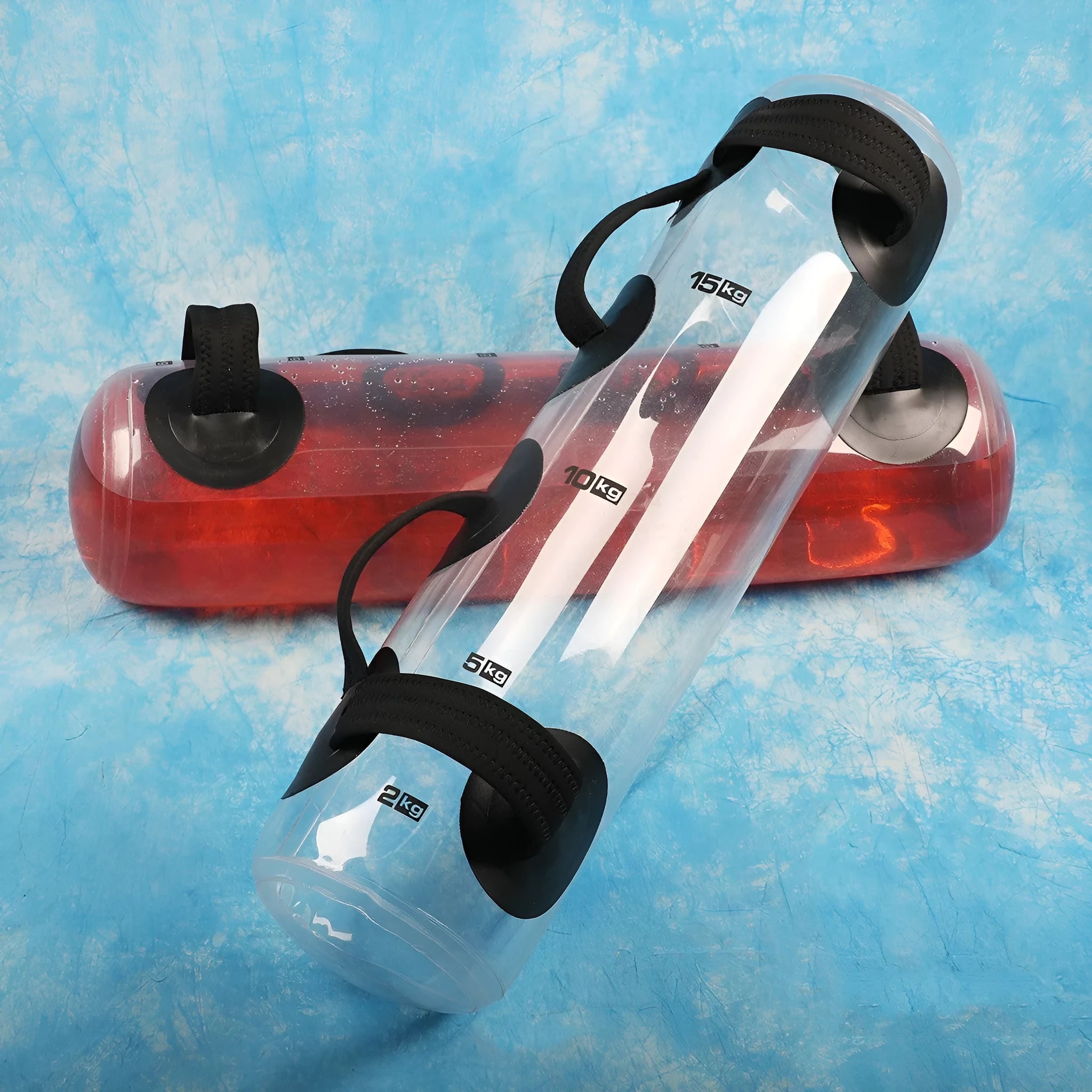 Transparent PVC inflatable water weight bag shown as a soft dumbbell shape for portable strength training.