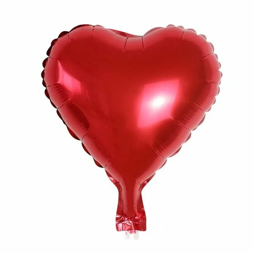Five sparkling peach heart-shaped aluminium foil balloons in assorted colours on a white background.