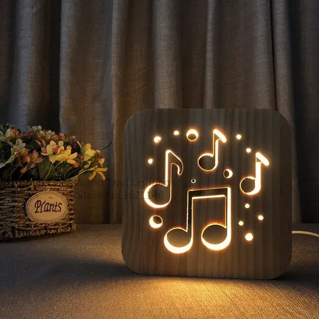 Square pine wood USB-powered LED lamp emitting warm white 3D light on a table.
