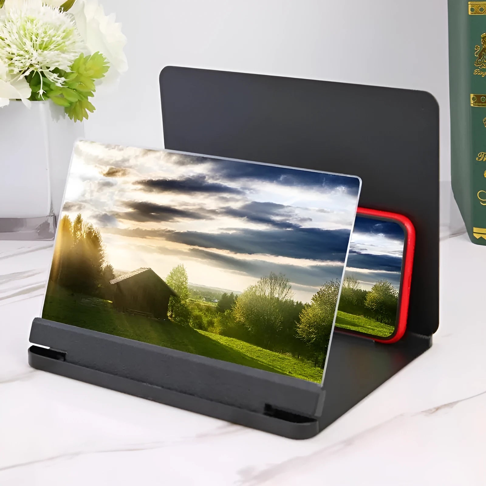 White phone screen amplifier showing smartphone magnification with plexiglass lens and fibreboard frame