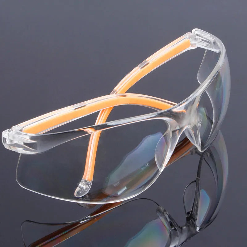 Transparent polycarbonate safety goggles with yellow lenses for eye protection.