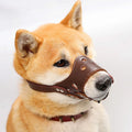 Black dog muzzle silencer for large breed on a sizing chart showing measurements.