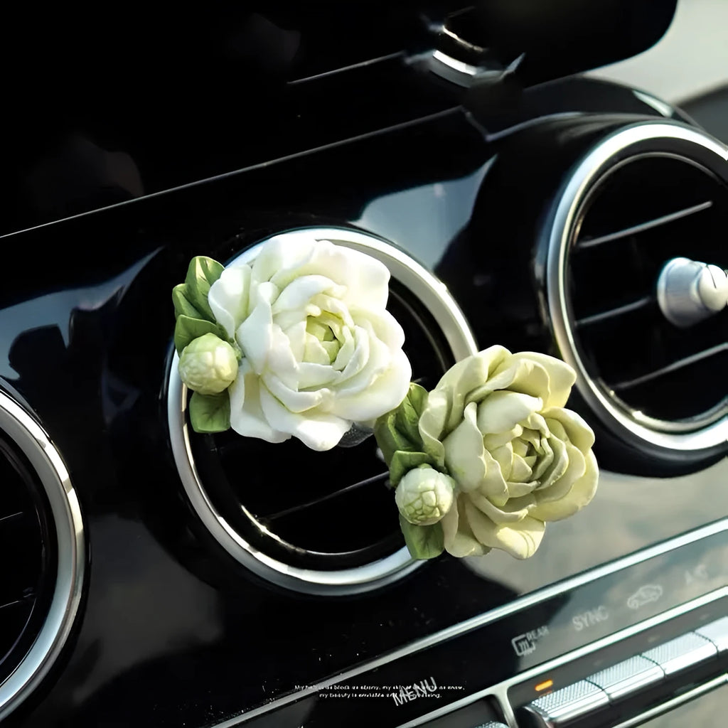 Jasmine-scented gypsum car air freshener ornament in off white or green, shown next to a 5ml essential oil bottle.