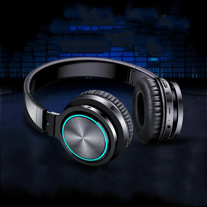 B12 wireless folding headset in black, black and red, or white and grey colour options showing head-mounted design