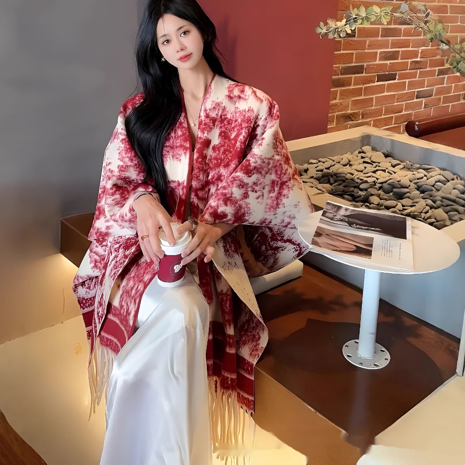 Women's casual scarf cape with tassel trim, shown in a selection of colours.
