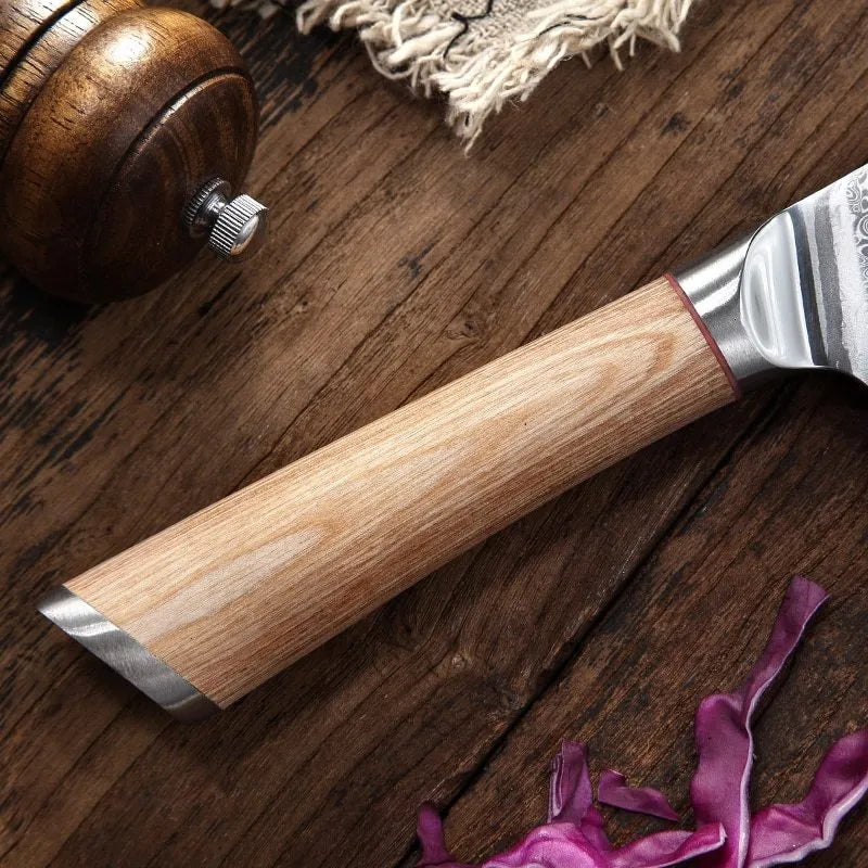 V gold Damascus kitchen knife set with 67-layer steel construction showing distinctive patterning on multiple blade sizes