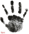 Baby hand and footprint ink pad set with non-toxic washable ink in black red and blue colours on white background