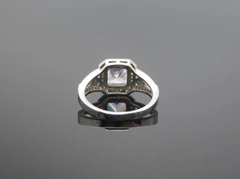 Geometric hollow women's ring with quadrilateral pattern and zircon stones in platinum finish
