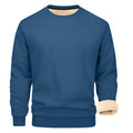 Solid colour loose fit cashmere blend pullover sweater with round neck and long sleeves on model