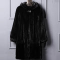 Women's black faux fur hooded coat with regular sleeves on a hanger