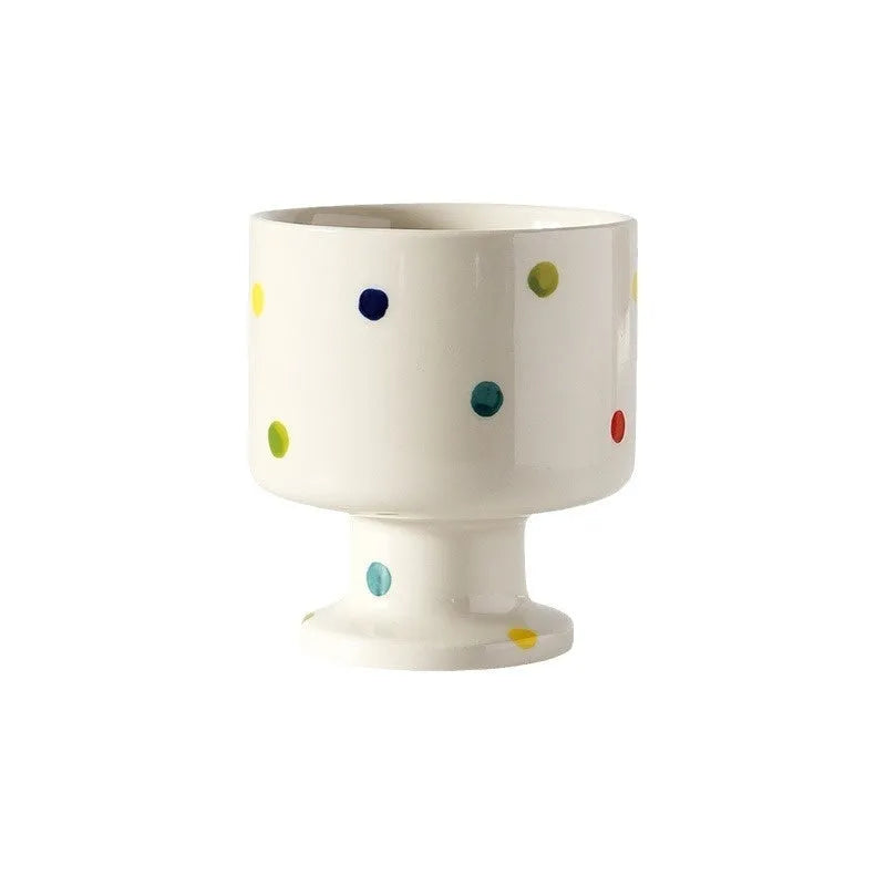 Hand-pinched irregular shaped ceramic mug in a solid colour, showing its unique handmade form.