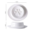 Green ceramic slow feeder pet bowl with internal maze pattern and raised basin design on a wooden floor.