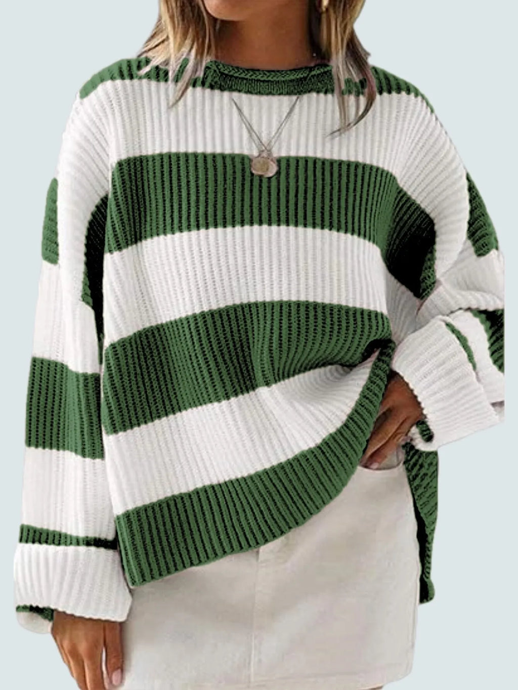 Women's striped loose sweater with bell sleeves and crocheted flower decoration.