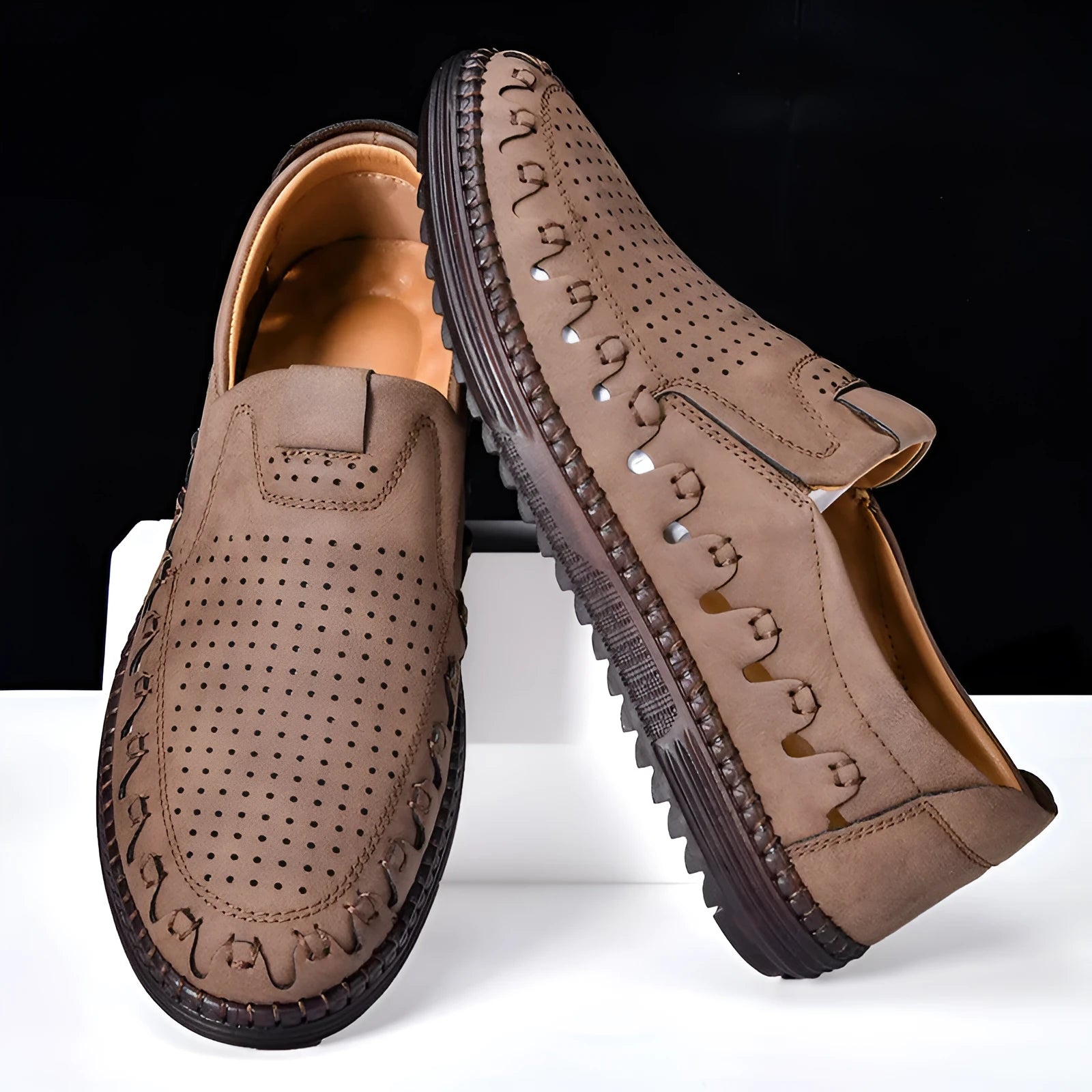 Men's brown slip-on casual shoes made of PU leather with a flat sole and round toe cap.