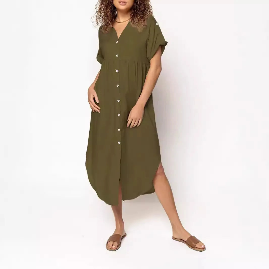 Loose mid-length casual dress in solid colour with button front detail, shown on a hanger.