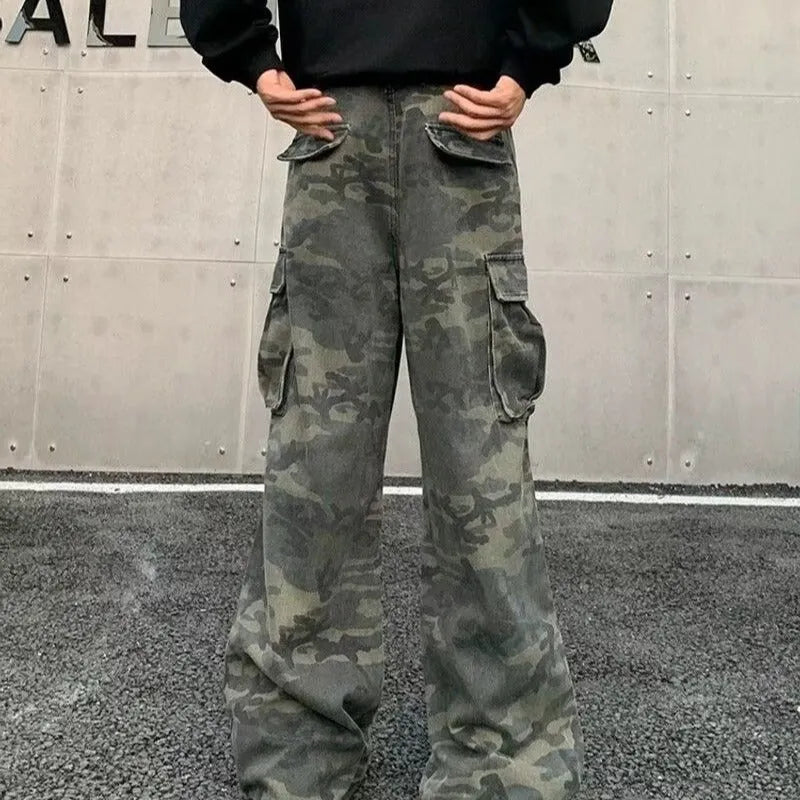 Cotton-blend cargo trousers in a washed camouflage pattern with multiple pockets, shown in colour K0915.