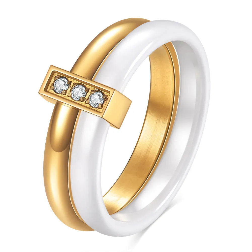 Glossy black ceramic women's ring with round zirconium stones on a geometric 6mm band.