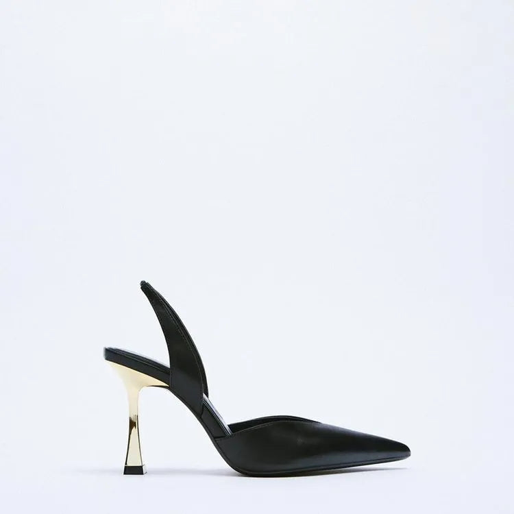Women's nude apricot pointed toe patent leather high heels on a white background.