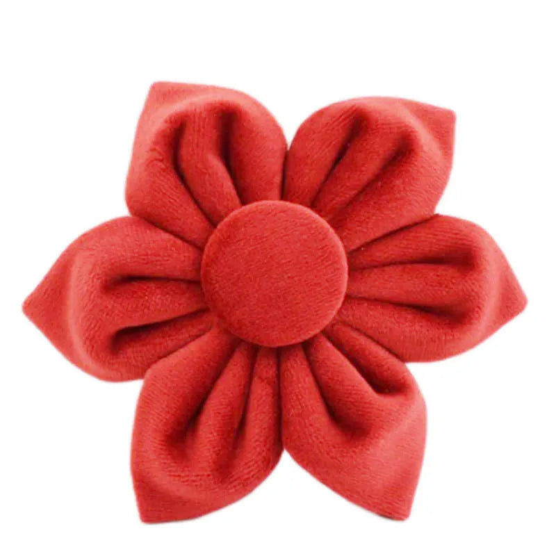 Cloth dog collar and leash set with red bow, matching vest, and flower accessory on a small dog.