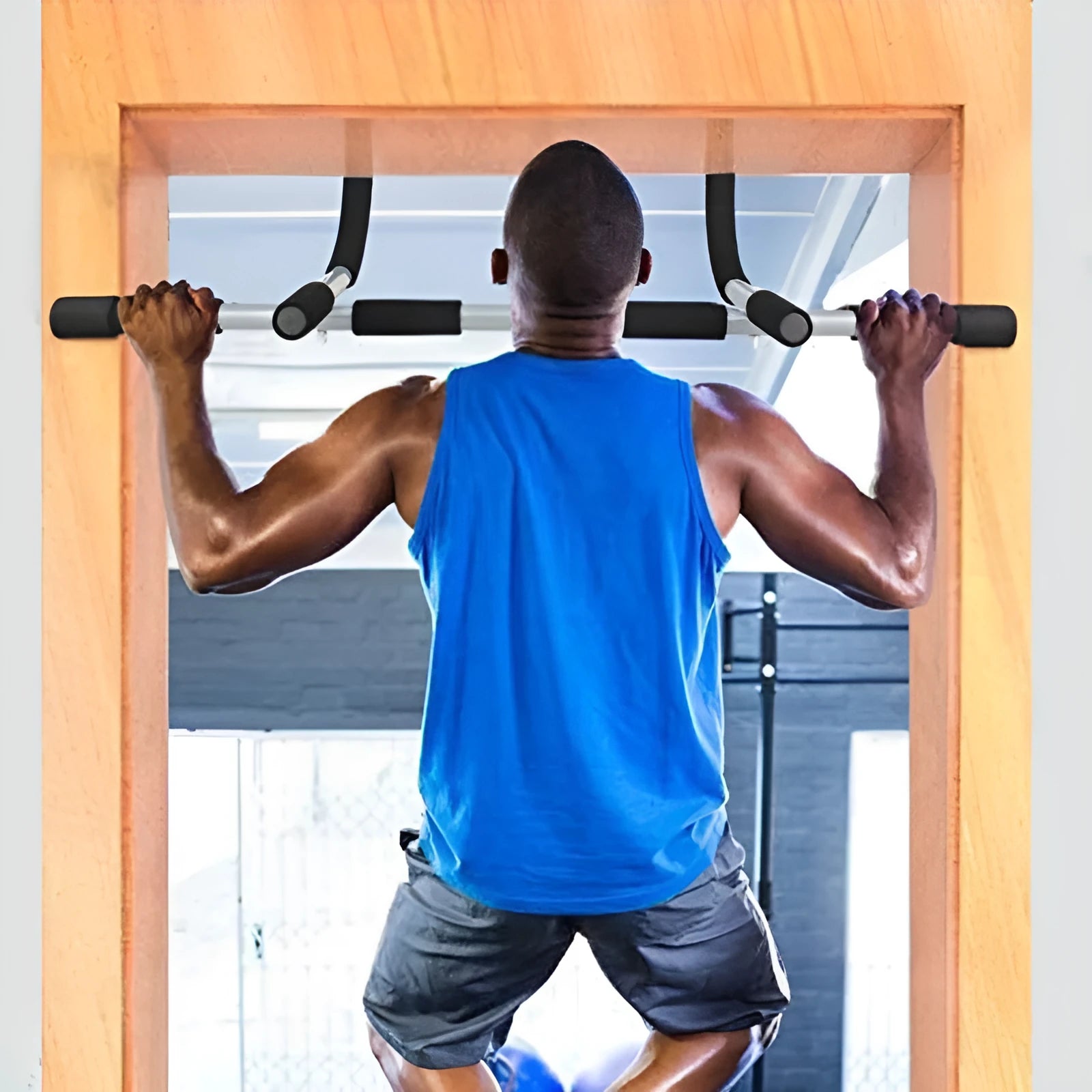 Black steel pipe indoor pull-up bar mounted on door frame for single and double poles exercises