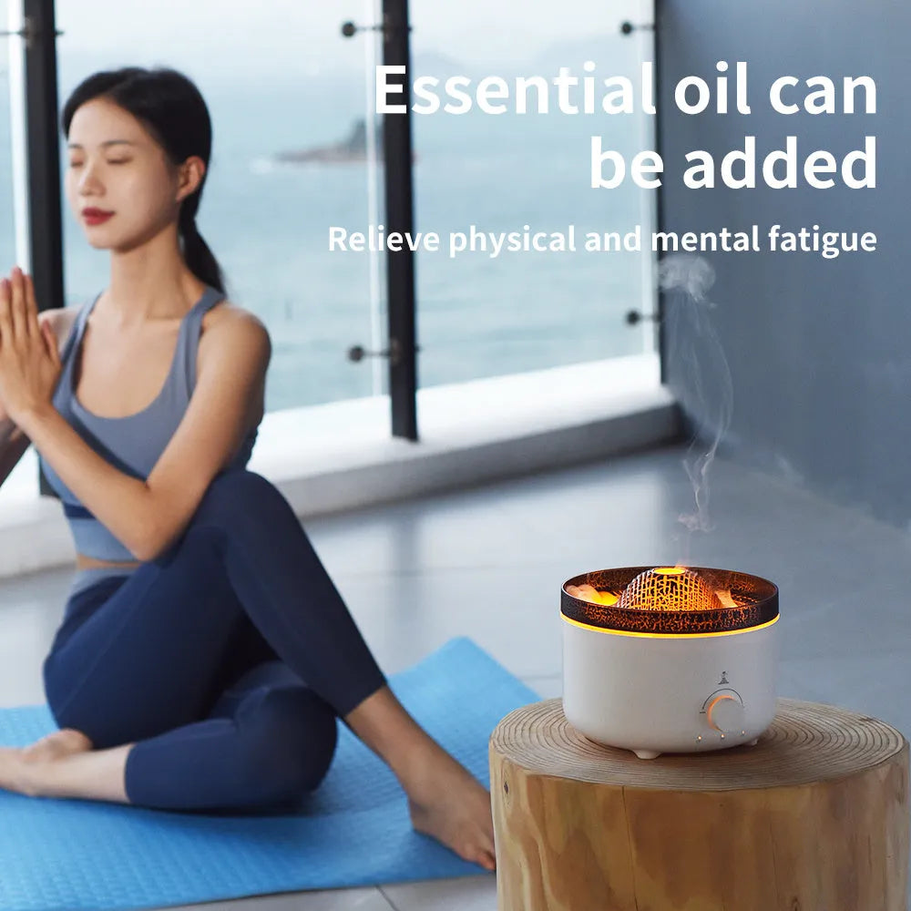 White simulated flame volcano humidifier diffuser with remote control on tabletop