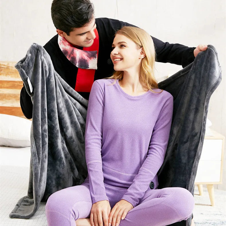 Dark grey USB heated flannel blanket showing soft coral fleece texture and attached USB cable