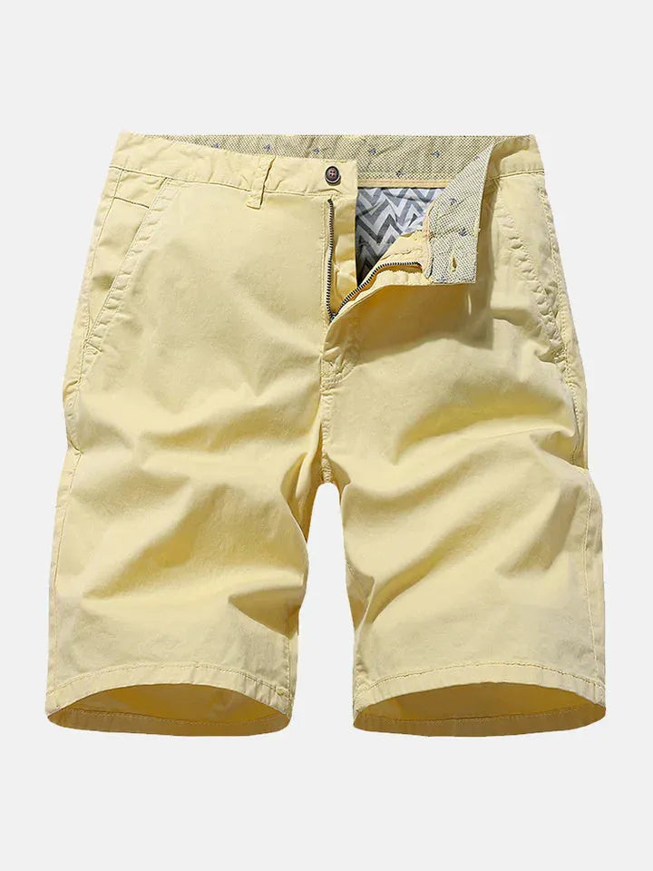 Man wearing loose-fitting blue denim casual shorts with an elasticated waistband.