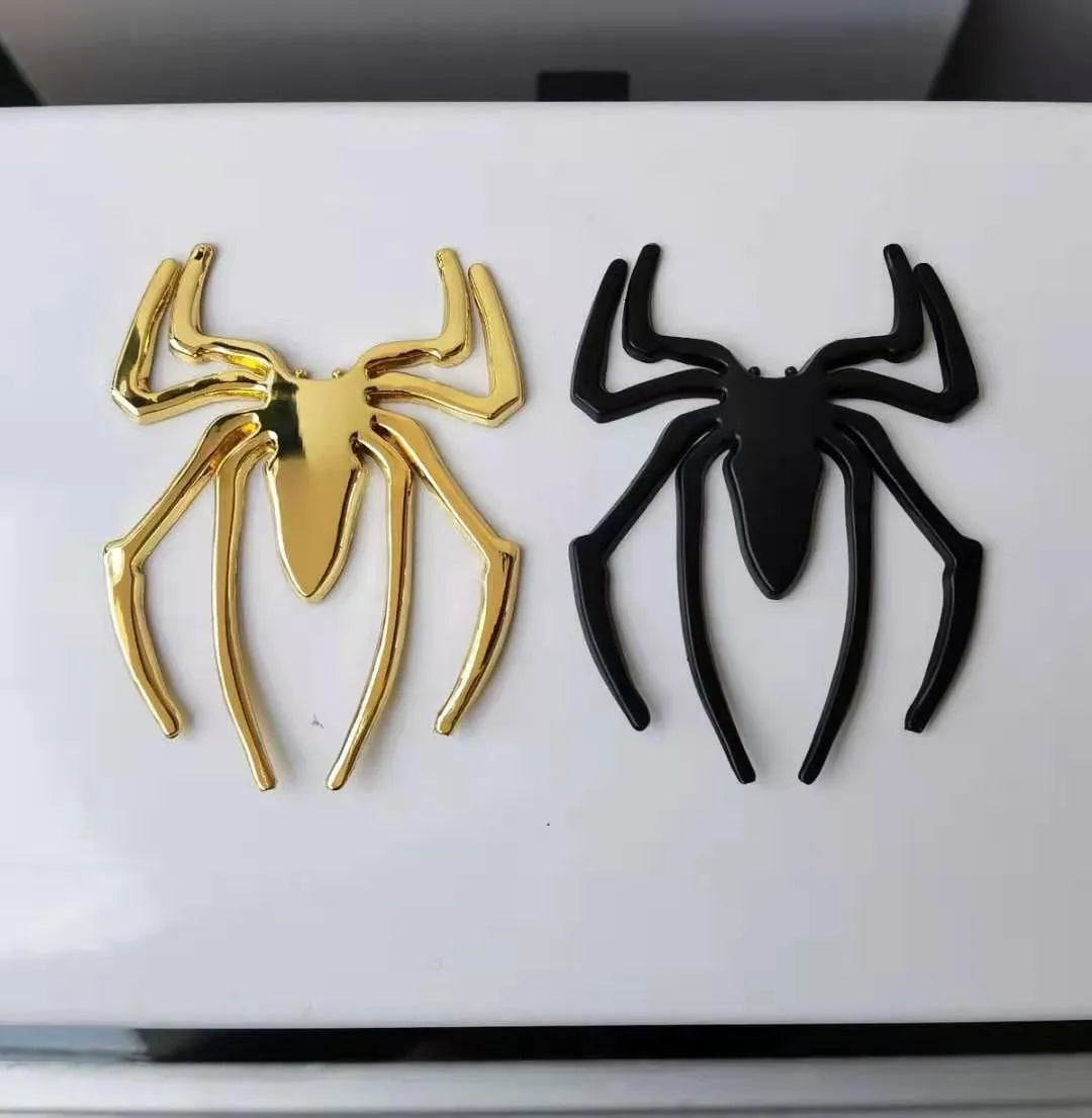 Three-dimensional zinc alloy spider emblem sticker in gold, measuring 7cm by 5cm.